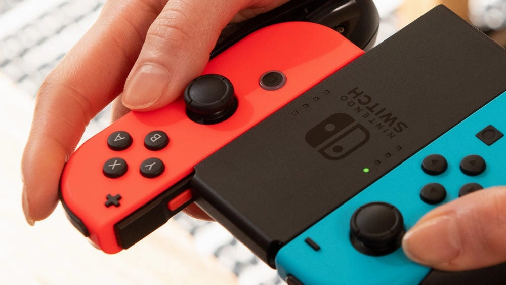 Nintendo Switch OLED Bundle 1: (Console  Joycon Grip Bag 2 New Games Mario Party Jamboree & Legend of Zelda: Echoes of Wisdom)